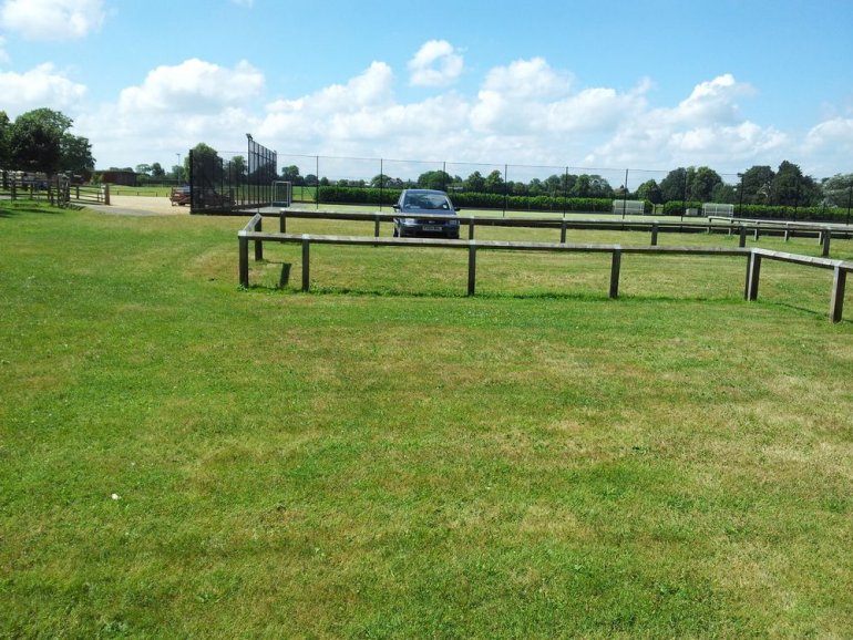 PERFO geogrid reinforcement of grass car park. PERFO allows natural drainage of the ground. Grass is not removed and grows through providing a pleasant looking environmentally friendly reinforced parking area
